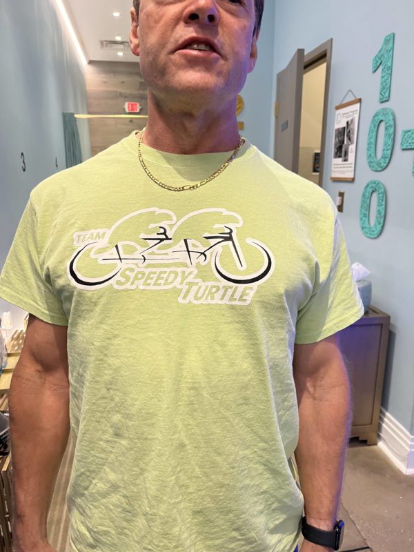 Team Speedy Turtle T-Shirt - Dave wearing shirt front side